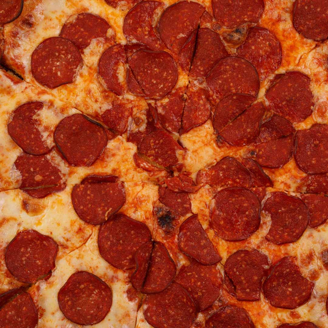 keto pizza made with wheat gluten and with salami