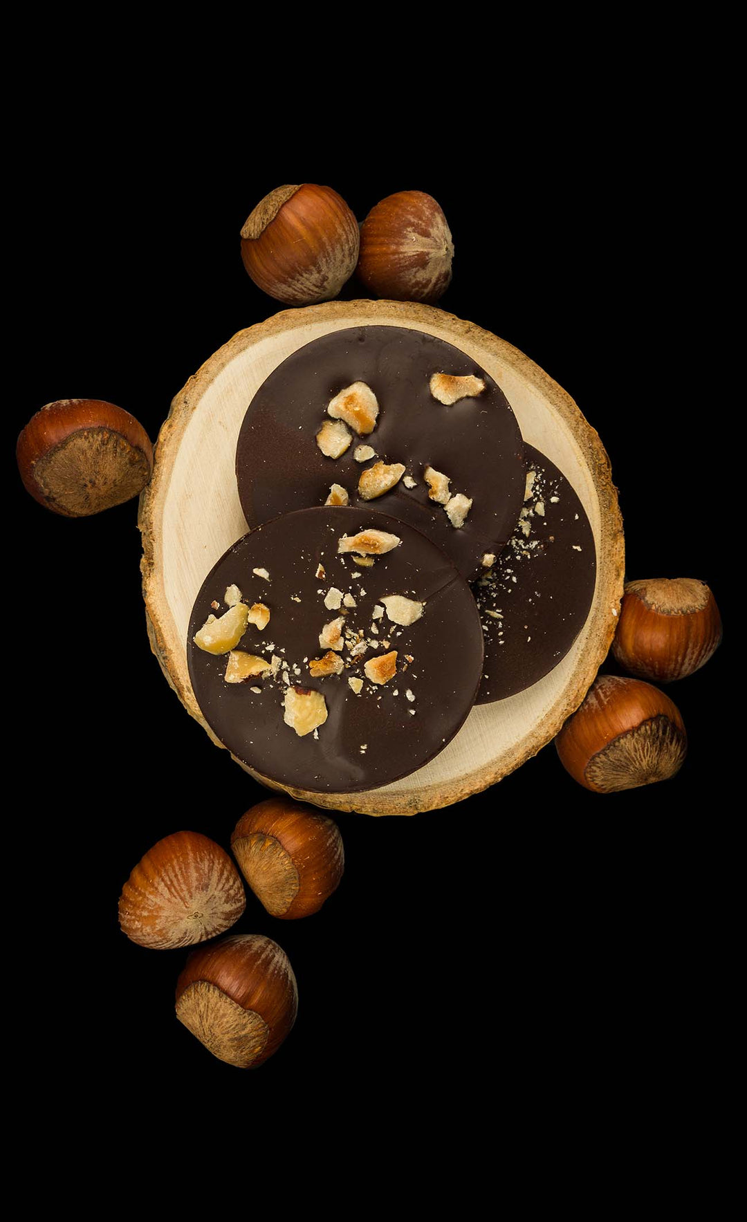 Goalz Allulose based dark chocolates with Hazelnut pieces surrounded by hazelnuts with shells